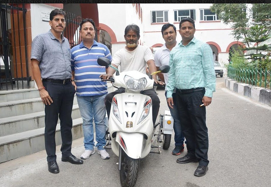 District administration hands over scooty to differently abled person