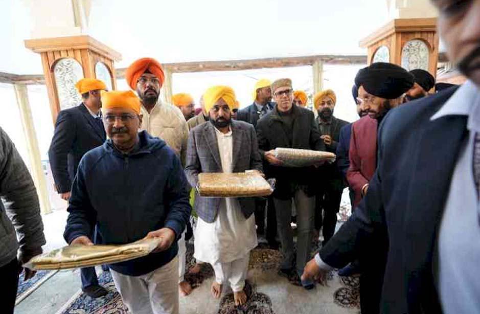 Mann Kejriwal Omar Abdullah take part in Sikh religious procession in Srinagar
